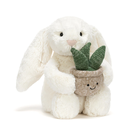 Cream bunny plush toy holding a plant – view 2